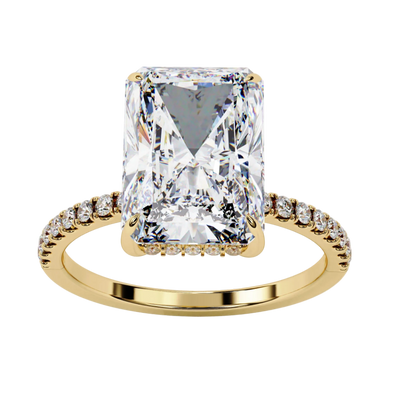 Symmetrical front view of radiant cut diamond ring in yellow gold.