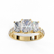 Top-down view of a yellow gold radiant cut three-stone diamond engagement ring highlighting the horizontal stone alignment.