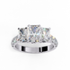 Top-down view of a white gold radiant cut three-stone diamond engagement ring highlighting the horizontal stone alignment.