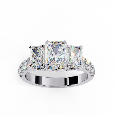 Top-down view of a white gold radiant cut three-stone diamond engagement ring highlighting the horizontal stone alignment.