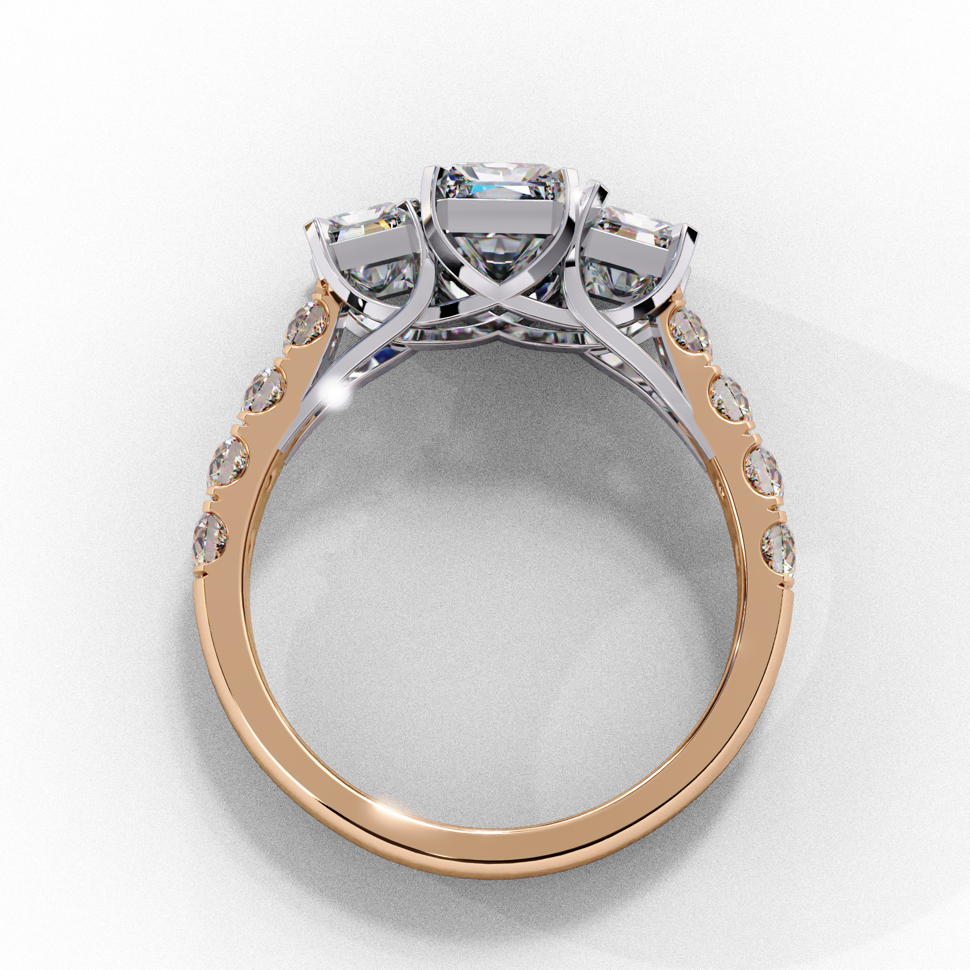 Side profile view of a rose gold radiant cut three-stone diamond engagement ring with an open basket setting.