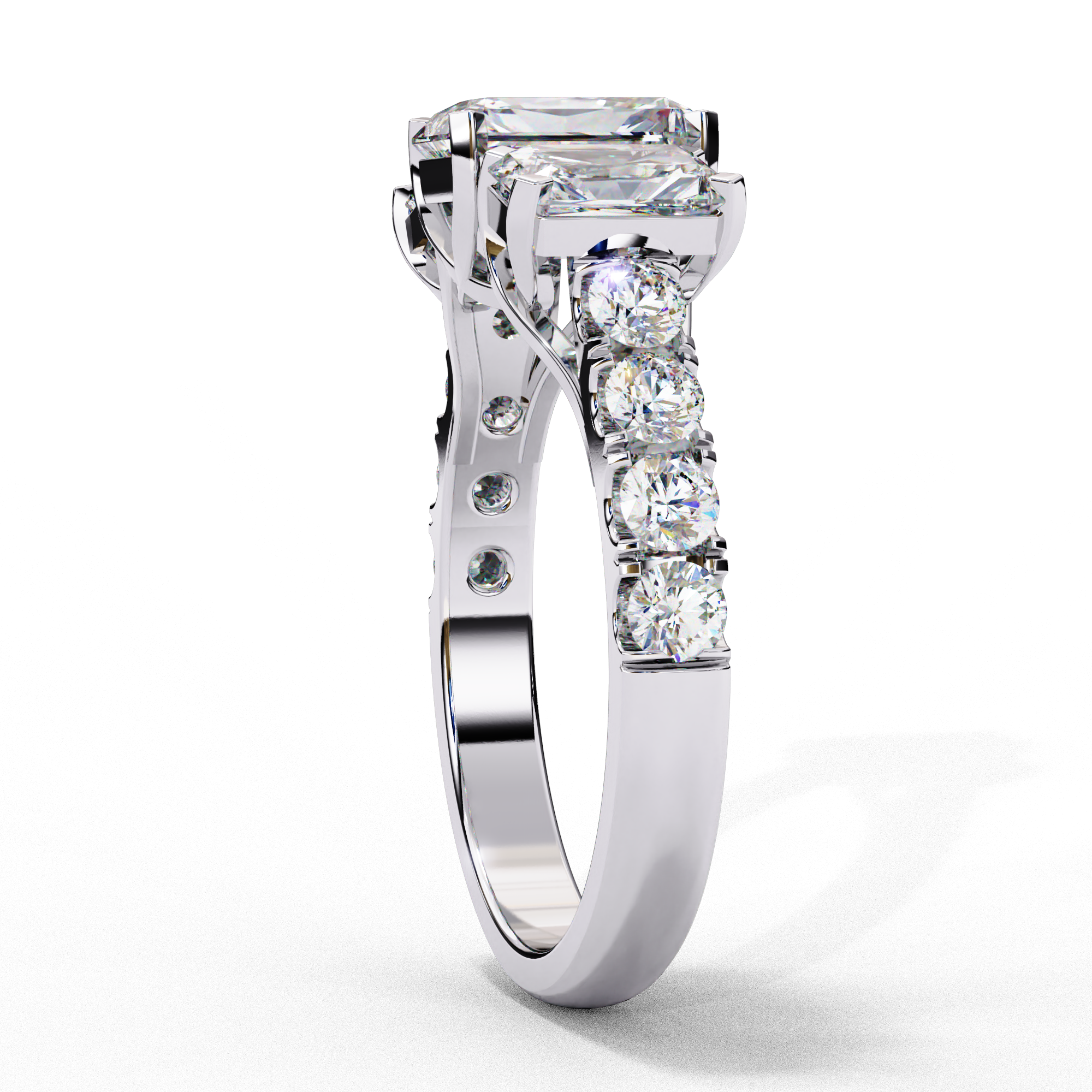 Side profile view of a white gold radiant cut three-stone diamond ring showing the diamond-accented band.