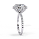 Close-up angled shot of a white gold cushion cut diamond double halo engagement ring highlighting the pavé shoulders.
