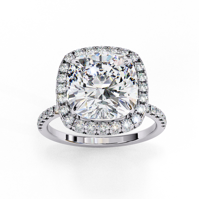 Top-down view of a white gold cushion cut diamond engagement ring with a brilliant double halo.
