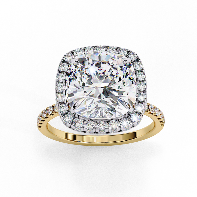 Top-down view of a yellow gold cushion cut diamond engagement ring with a brilliant double halo.