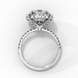 Side profile view of a white gold cushion cut diamond double halo engagement ring showing the elevated cathedral setting.