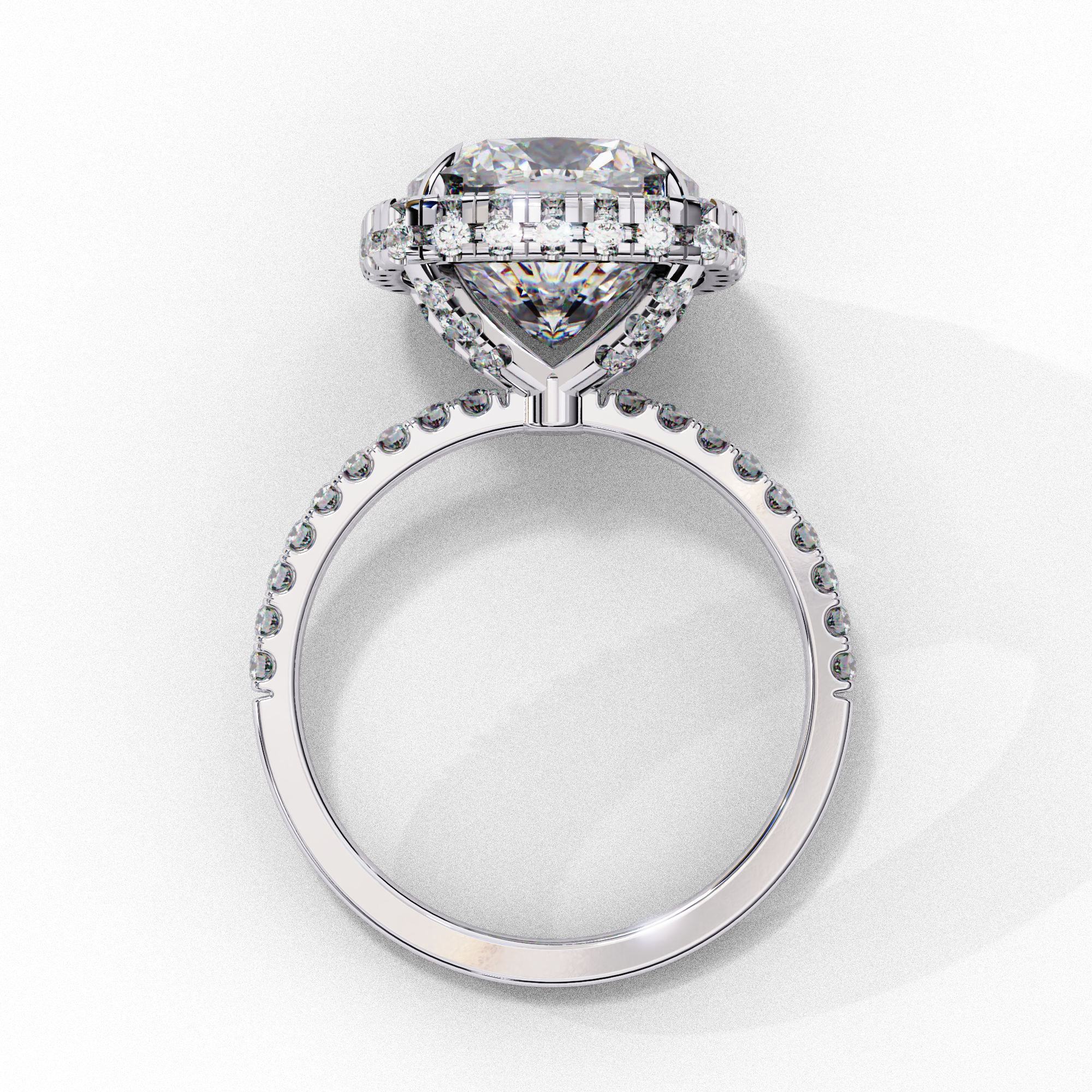 Side profile view of a white gold cushion cut diamond double halo engagement ring showing the elevated cathedral setting.