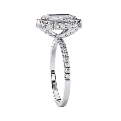 Side profile view of a white gold emerald cut diamond ring showing the diamond-accented pavé band.