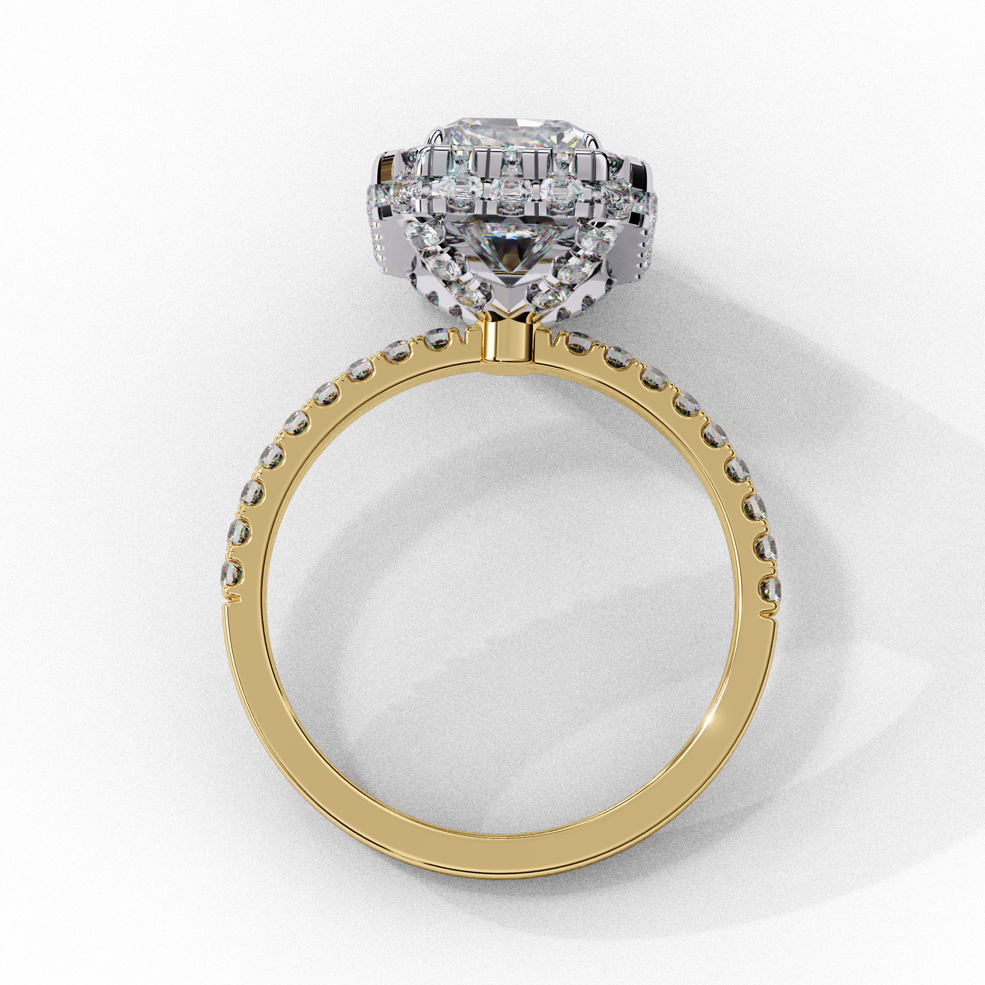 Side profile view of a yellow gold emerald cut diamond double halo engagement ring showing the cathedral setting.