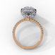 Side profile view of a rose gold emerald cut diamond double halo engagement ring showing the elevated cathedral gallery.