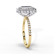 Side profile view of a yellow gold emerald cut diamond double halo engagement ring showing the elevated cathedral gallery.