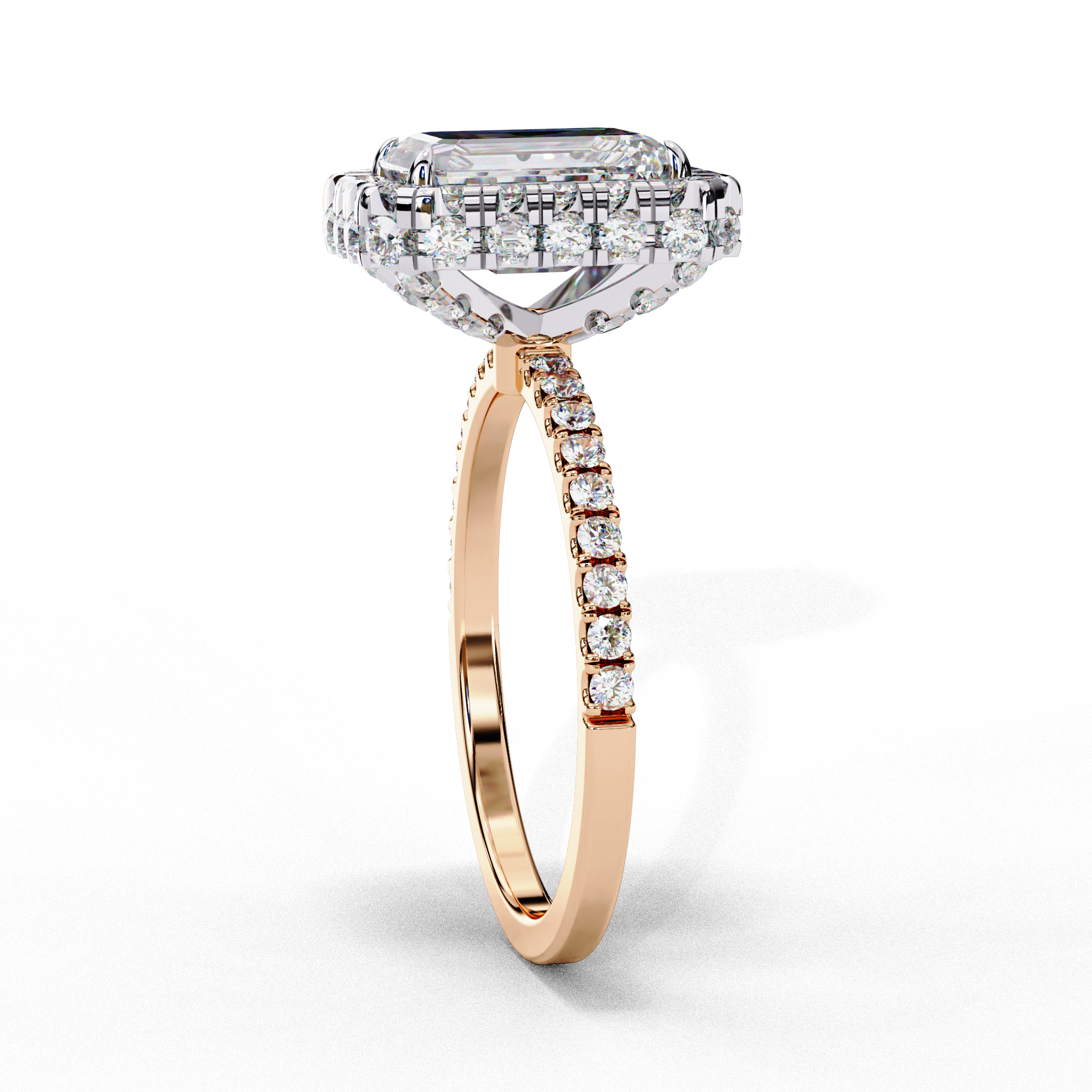Side profile view of a rose gold emerald cut diamond ring showing the diamond-accented pavé band.