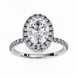 Top-down view of a white gold oval cut diamond engagement ring with a brilliant double halo.