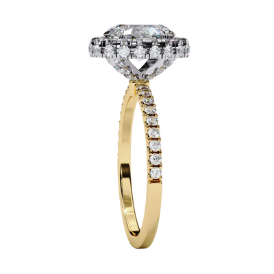 Side profile view of a yellow gold oval cut diamond double halo engagement ring showing the elevated cathedral gallery.