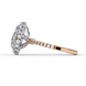 Side profile view of a rose gold pear shaped diamond halo engagement ring showing the cathedral setting.
