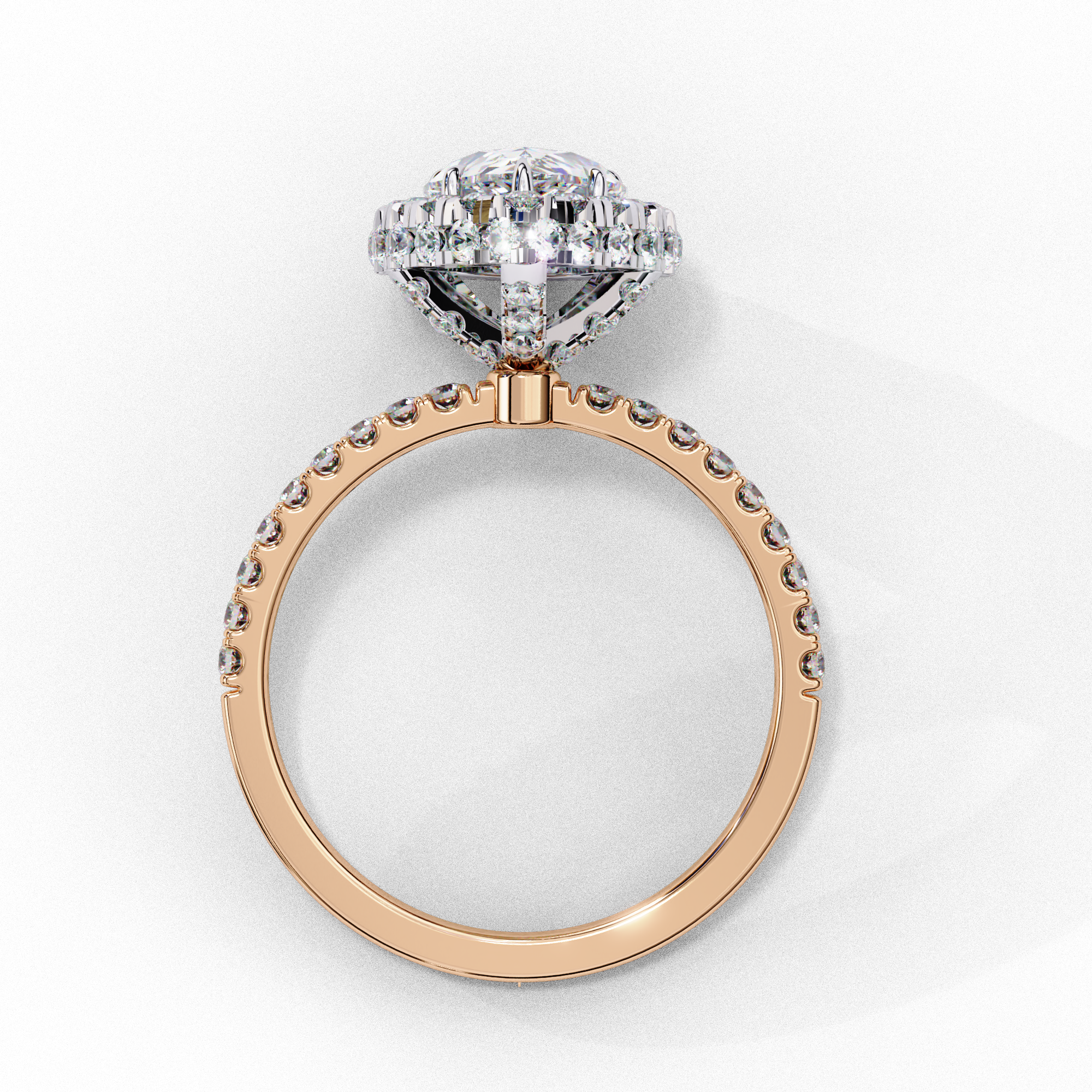 Side profile view of a rose gold pear shaped diamond halo engagement ring showing the elevated cathedral gallery.