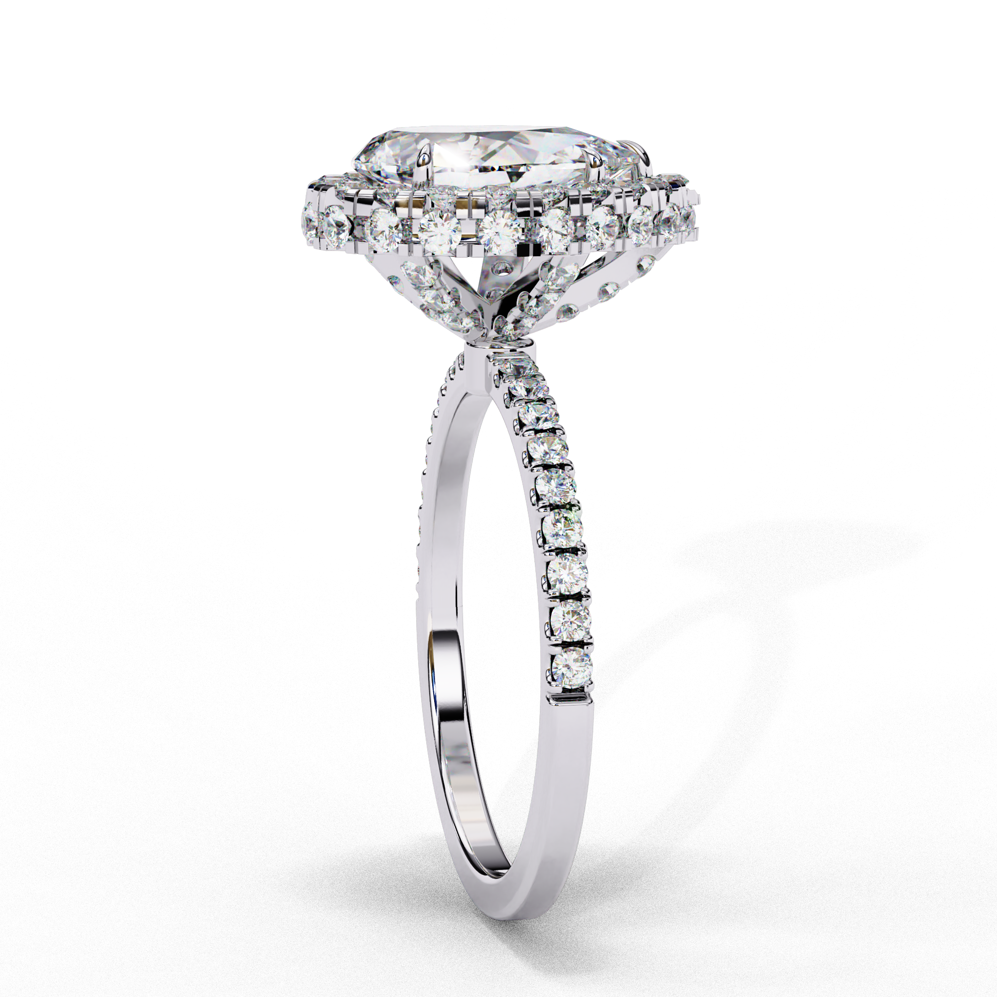 Side profile view of a white gold pear shaped diamond halo engagement ring showing the elevated cathedral gallery.