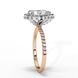 Side profile view of a rose gold pear shaped diamond halo engagement ring showing the elevated cathedral gallery.
