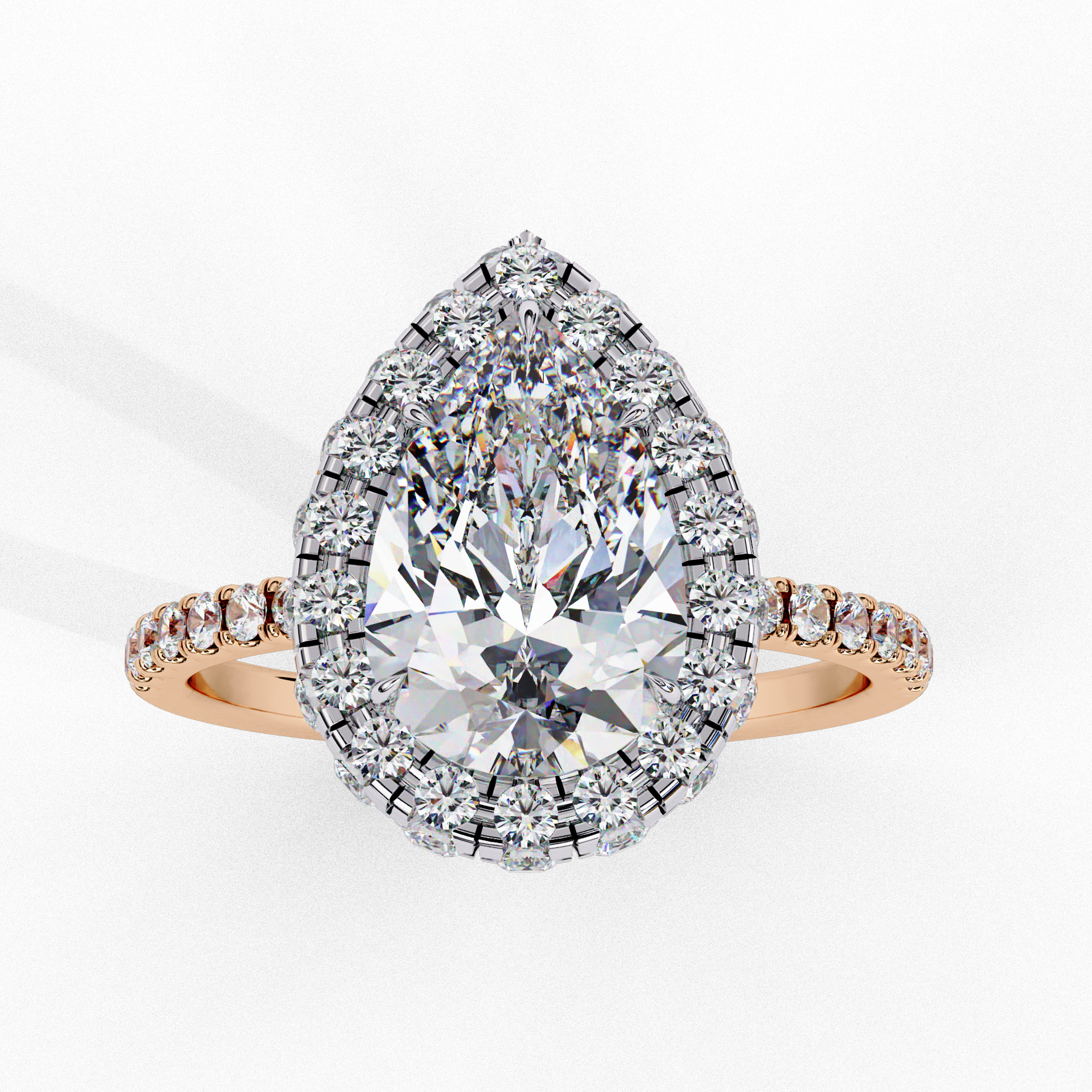 Front view of a rose gold pear shaped diamond halo engagement ring.