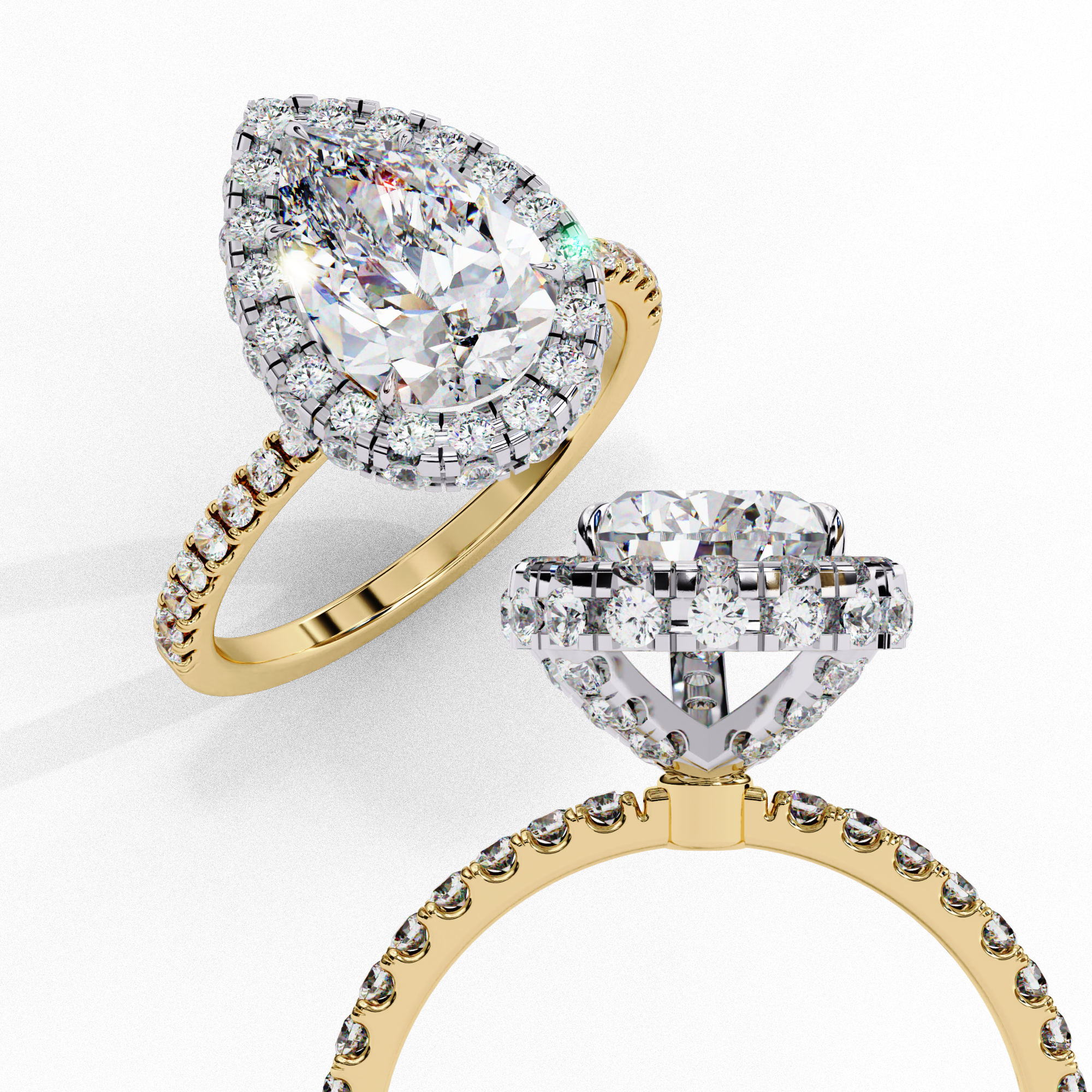 Close-up angled shot of a yellow gold pear shaped diamond halo engagement ring.