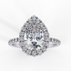 Front view of a white gold pear shaped diamond halo engagement ring.