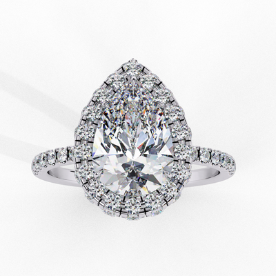 Front view of a white gold pear shaped diamond halo engagement ring.