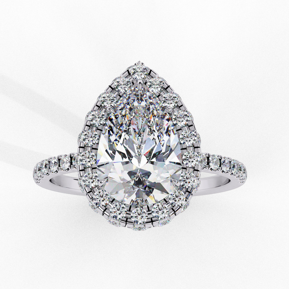 Front view of a white gold pear shaped diamond halo engagement ring.