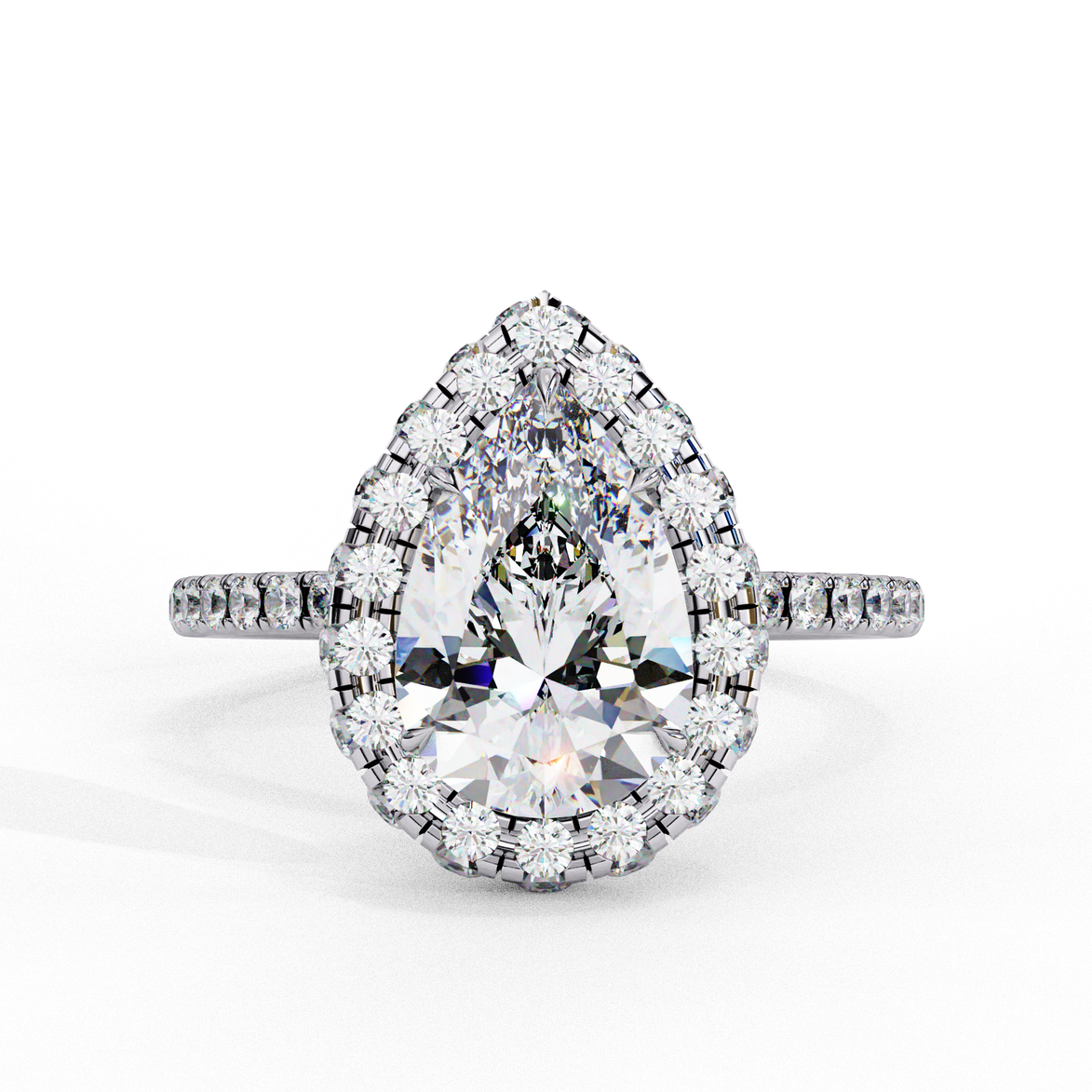 Top-down view of a white gold pear shaped diamond engagement ring with a brilliant halo frame.