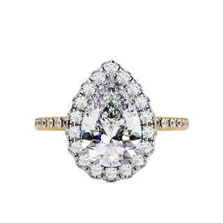 Top-down view of a yellow gold pear shaped diamond engagement ring with a brilliant halo frame.