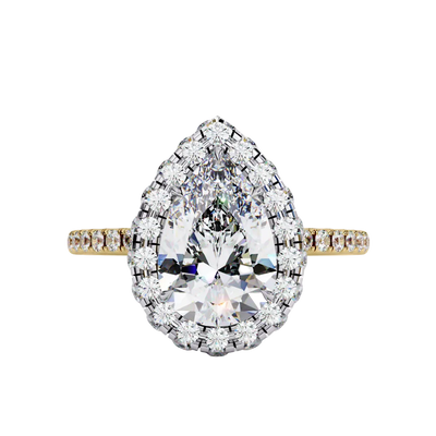 Top-down view of a yellow gold pear shaped diamond engagement ring with a brilliant halo frame.