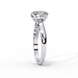 Side profile view of a white gold round brilliant cut diamond solitaire engagement ring.