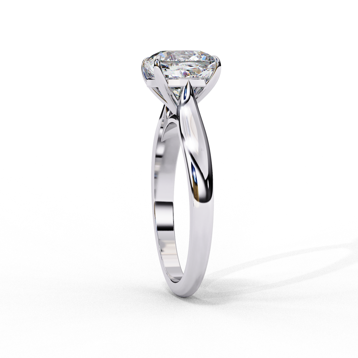 Side profile view of a white gold round brilliant cut diamond solitaire engagement ring.