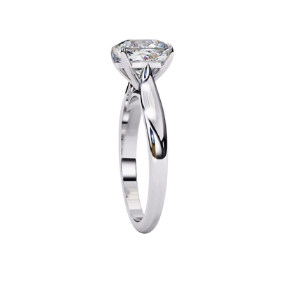 Side profile view of a white gold round brilliant cut diamond solitaire engagement ring.