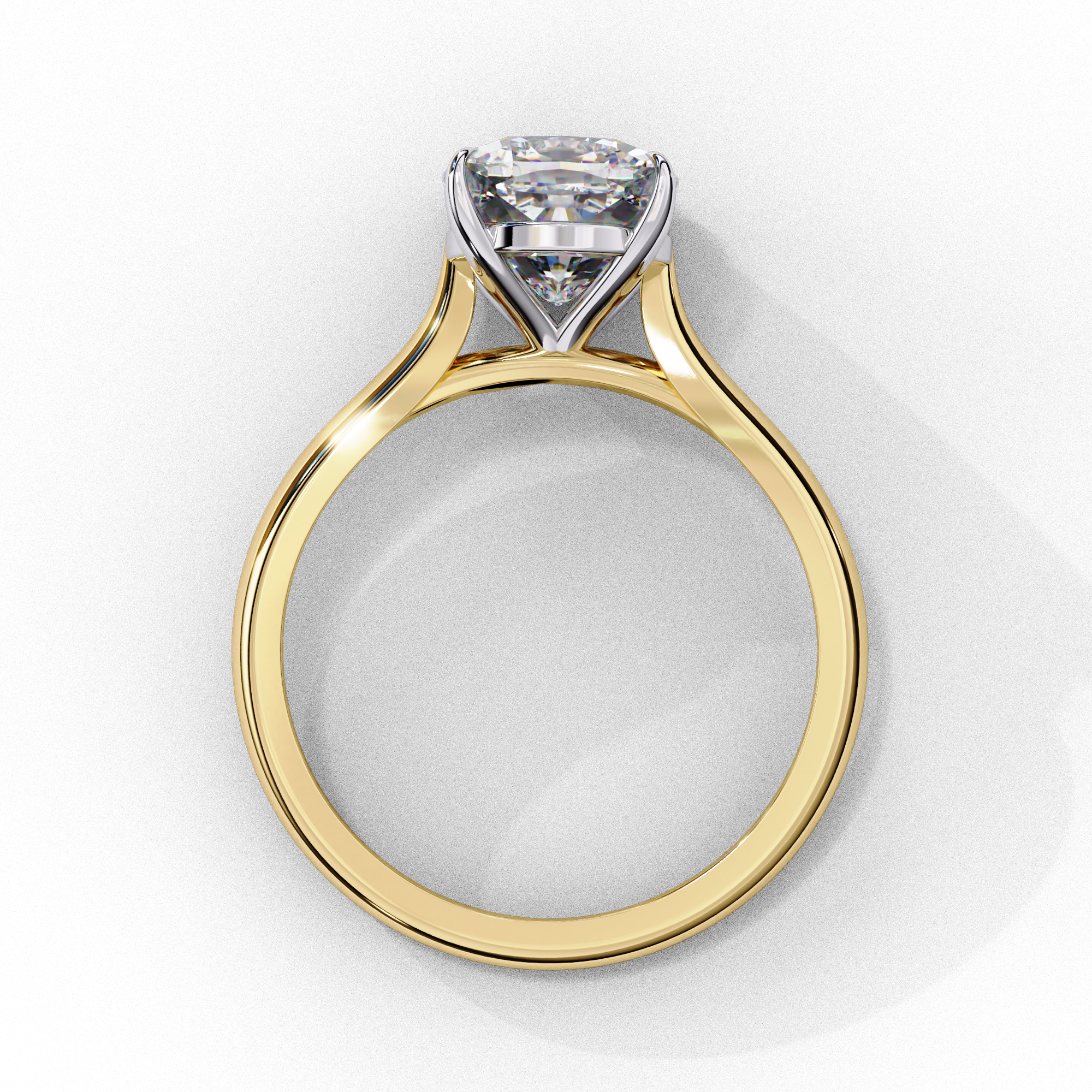 Side profile view of a yellow gold round brilliant cut diamond solitaire ring showing the classic four-prong head layout.