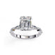 Side profile view of a rose gold emerald cut diamond engagement ring showing the elegant cathedral gallery profile.
