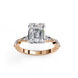 Side profile view of a rose gold emerald cut diamond ring showcasing the multi-stone layout along the band.