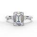 Front view of a white gold emerald cut diamond engagement ring with alternating marquise and round accent diamonds.