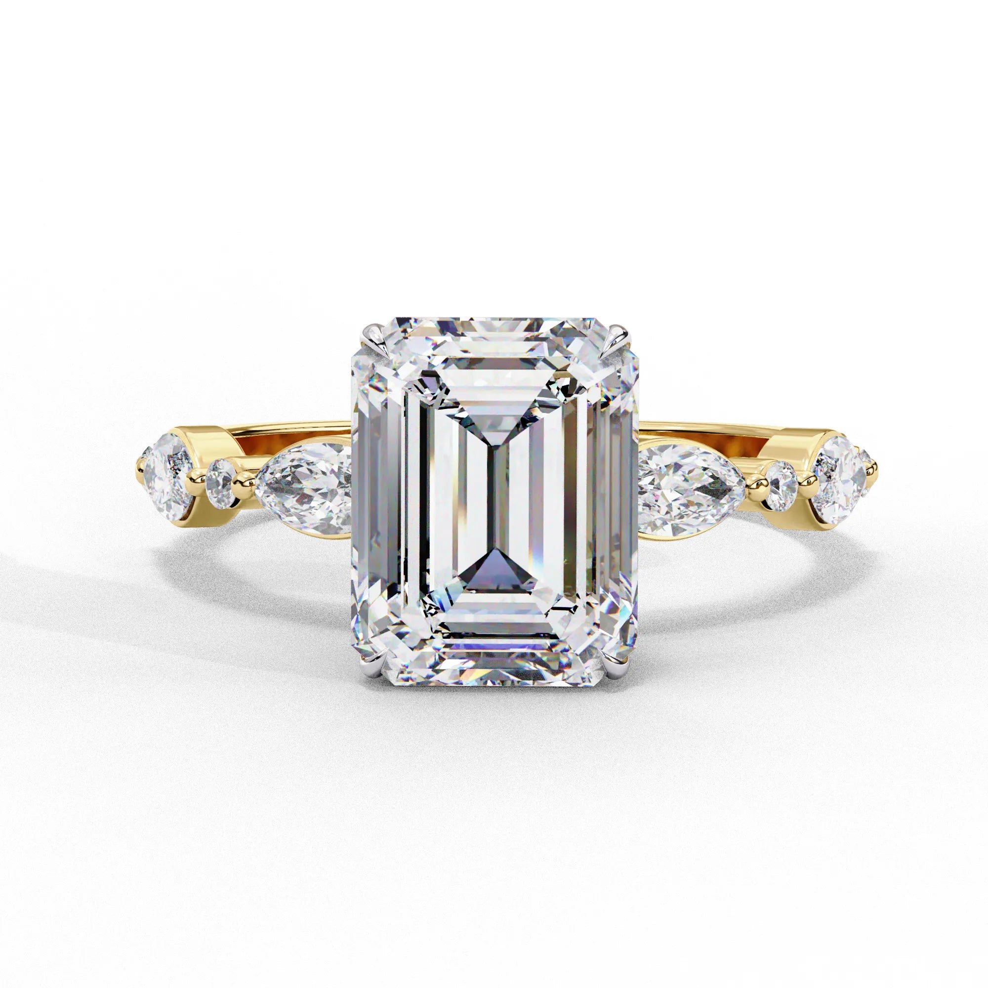 Front view of a yellow gold emerald cut diamond engagement ring with alternating marquise and round accent diamonds.