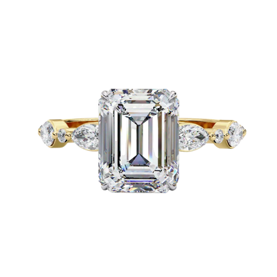 Front view of a yellow gold emerald cut diamond engagement ring with alternating marquise and round accent diamonds.
