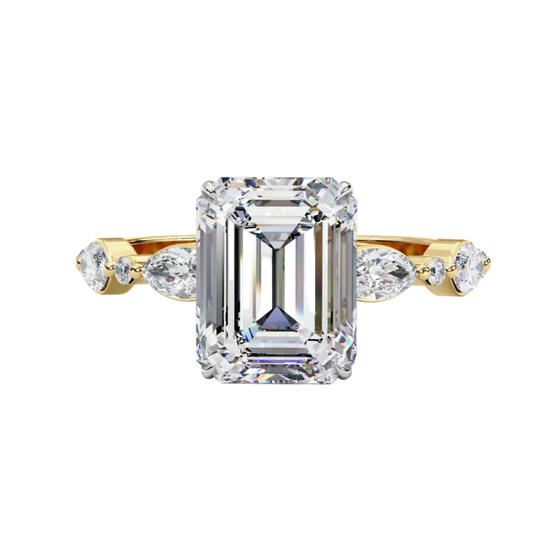 Front view of a yellow gold emerald cut diamond engagement ring with alternating marquise and round accent diamonds.