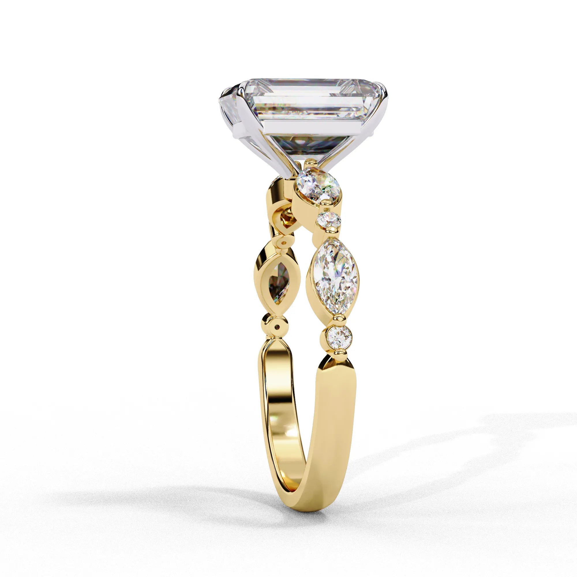 Side profile view of a yellow gold emerald cut diamond engagement ring showing the elegant cathedral gallery profile.