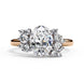 Front view of a rose gold oval cut diamond engagement ring featuring symmetrical floral cluster side stones.