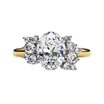 Front view of a yellow gold oval cut diamond engagement ring featuring symmetrical floral cluster side stones.