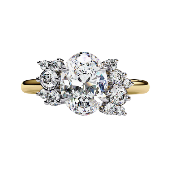 Front view of a yellow gold oval cut diamond engagement ring featuring symmetrical floral cluster side stones.