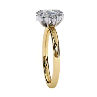Side profile view of a yellow gold oval cut diamond engagement ring highlighting the open under-gallery construction.