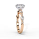 Side profile view of a rose gold round brilliant cut diamond engagement ring showcasing an elegant cathedral gallery profile.