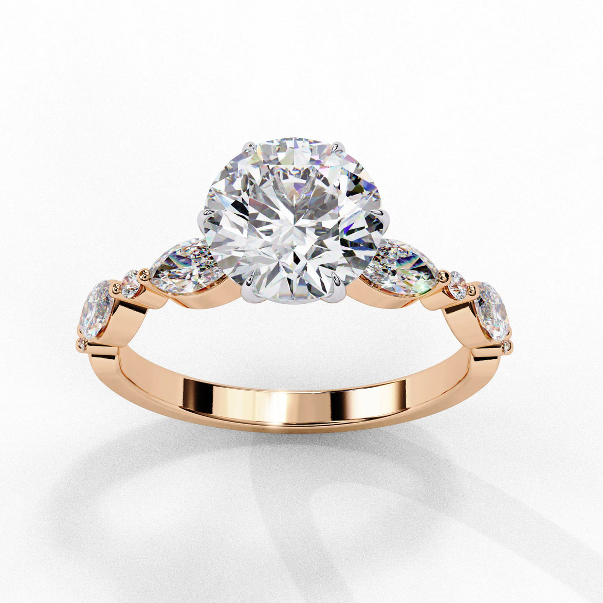 Side profile view of a rose gold round brilliant cut diamond ring highlighting the unique multi-shape accent stones along the band.