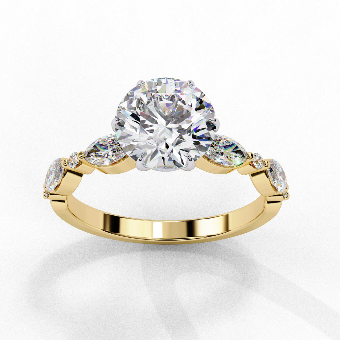 Side profile view of a yellow gold round brilliant cut diamond ring highlighting the unique multi-shape accent stones along the band.