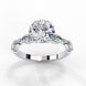 Side profile view of a white gold round brilliant cut diamond ring highlighting the unique multi-shape accent stones along the band.