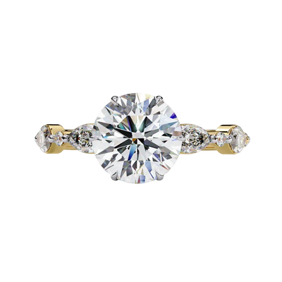 Front view of a white gold round brilliant cut diamond engagement ring with symmetrical marquise and bezel-set side stones.